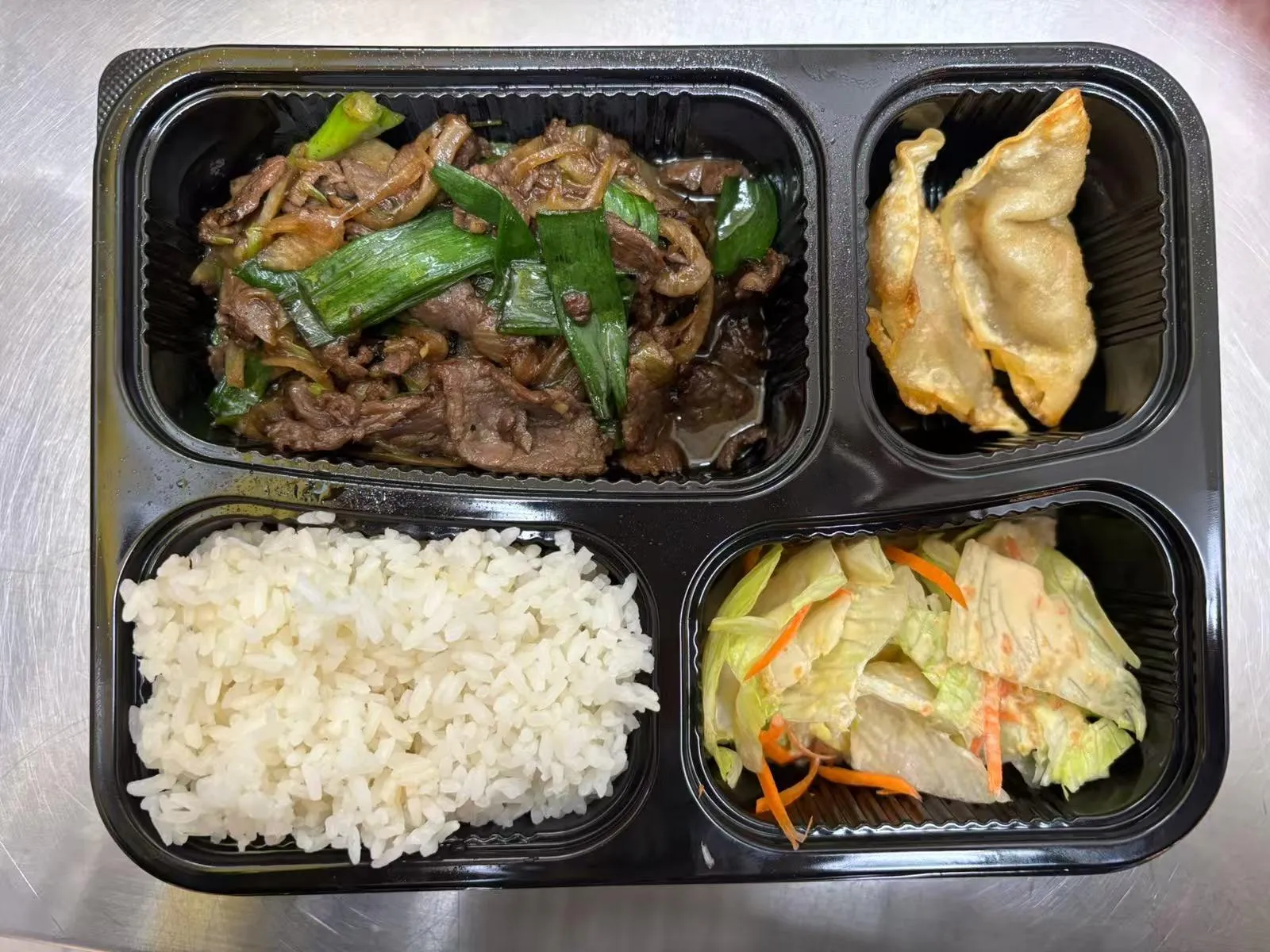 Bento box with beef scallion stir-fry at Zen Bento, a Asian Restaurant in Wichita